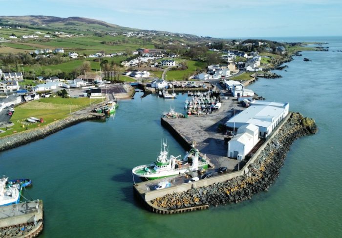 Bird's eye view of Greencastle Harbor with moored boats. Donegal, Ireland.
